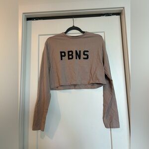 Alphalete “Proud But Never Satisfied” Mauve Cropped Top